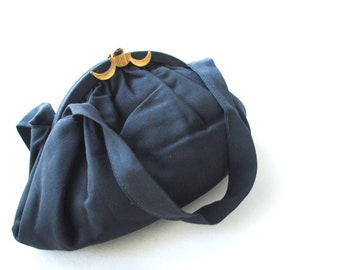 Art deco vintage 40 s, black rayon , puffy , gathered, formal   hand bag with a gold tone metal geometric clasp and coin purse.