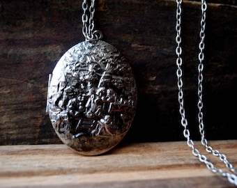 Victorian style vintage 70s silvertone metal necklace with  a large, oval pendant -locket and old country scene on it.