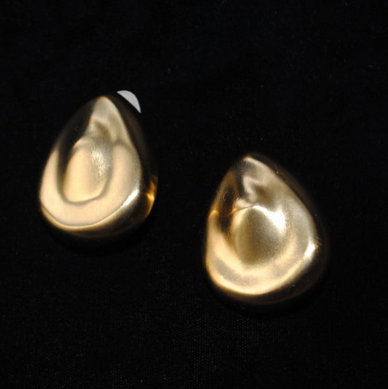 tear drop shape clip on earrings Runway vintage 80s Made by Essex. sculptured gold tone metal satin russian massive
