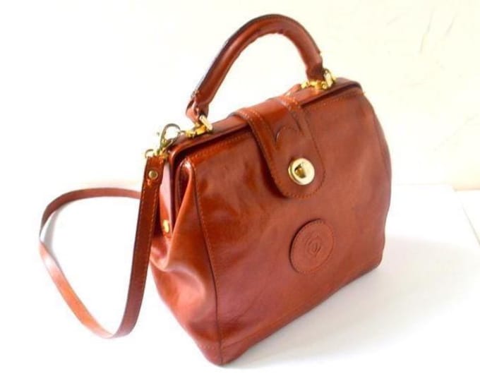 1990 vintage , cognac  brown genuine leather , doctor style, hand made bag with top  handle and handle strap, by Romano di Paolo, Italy