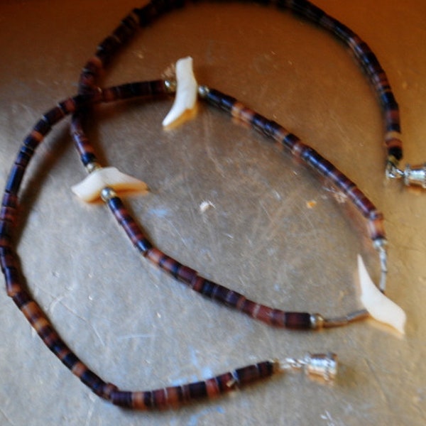 1960 vintage , Native  American ,   one strand  choker necklace , brown heishi  shell beads, three carved  white mother  pearl  zuni birds.