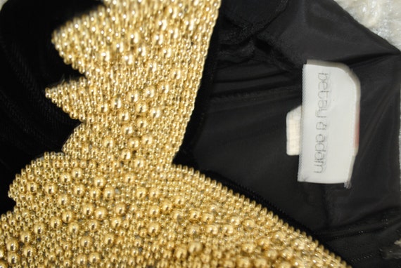 Gatsby Vintage 80s Black Velvet Mini Dress with A Spagetti Straps and Art Deco Style Gold Emballishment. Made by Betsy& Adam.Size 6.