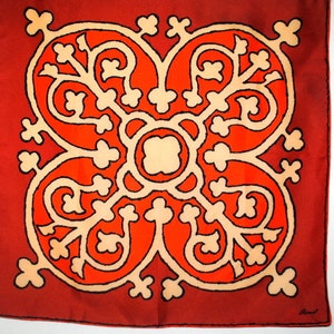 Mod vintage 1960s,  terracotta  acetate scarf with an abstract geometric pattern and black trim. By Burmel.
