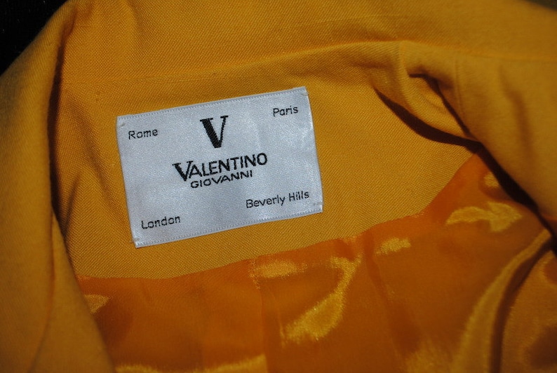 Beverly Hills Giovanni London Paris Luxurious vintage 80s canary yellow rayon blend suit.Made by Valentino Rome Size Medium.