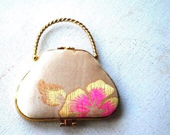 1960   miniature double  mirror compart,  purse shape,  cream color  Asian silk with floral motive,  hinged, gold tone metal frame/ handle