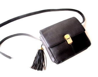 Classy  vintage 1990  ,dark chocolate brown, cross body,  shoulder,  bag, purse with  tassel, adjustable strap.  By  Signature Studio.