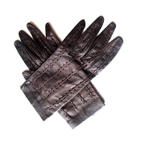 Classy vintage 1960s,  dark plum color , genuine kid,  short gloves with a cross stitched  embroidery and cutouts. Size 6 1/2