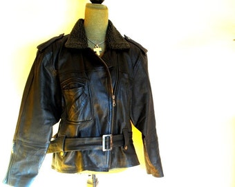 1980 vintage black  heavy duty stiff leather,  women's, biker, motorcycle, winter jacket. By  M. G. R. Size Large.