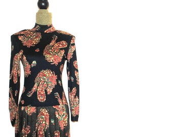 Fall fashion vintage 1990s, black rayon , maxi dress with a multi color, large paisley print. By Madison Ave. Size 8 P.