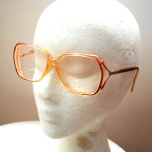 Iconic vintage 1970, oversize  eyeglasses with clear peach-pink lucite  frame and  pastel pink bifocal , optical lenses. By Cristallav .