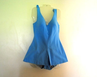 Mod  vintage 60s, sky blue, stretched nylon , one   piece  swim suite. Made by Cole of California. Size 16.