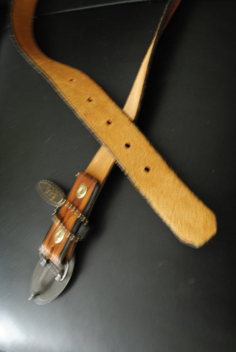 Boho vintage 70s caramel brown, genuine tooled leather, womens belt with oval shape, brass ,Lee buckle. image 5