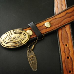 Boho vintage 70s caramel brown, genuine tooled leather, womens belt with oval shape, brass ,Lee buckle. image 4