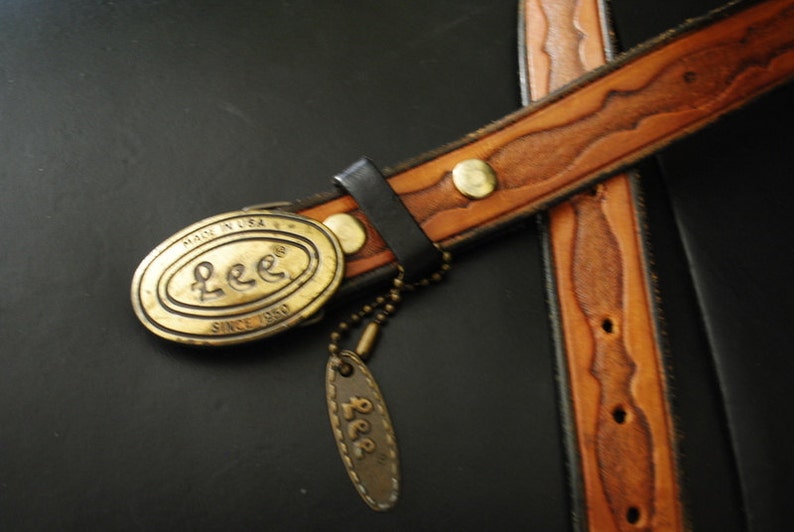 Boho vintage 70s caramel brown, genuine tooled leather, womens belt with oval shape, brass ,Lee buckle. image 4