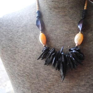 Contemporary  vintage 1990,  wood beads  necklace  with   black  wood  ships and   mother  shell , large   oval beads.