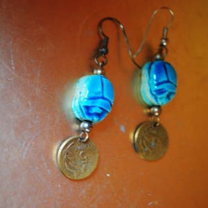 Exotic vintage 70s, aqua , egyptian scarab with a dangle, original, peruvian coin, drop,  hand made , fish hook earrings.