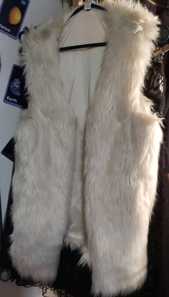 white fluffy vest
