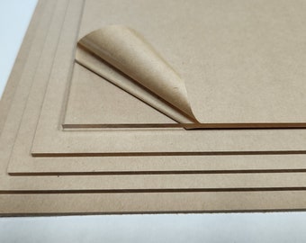 May include: Stack of five brown craft sheets with a protective paper covering peeled back on the top sheet.