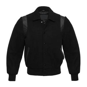 May include: A black varsity jacket with a button-up front, a collar, and black leather-like shoulder patches. The jacket has ribbed cuffs and a ribbed hem. The jacket is made of a thick material.