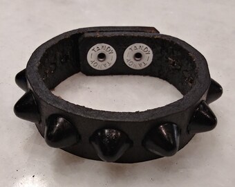 Leather cuff with black cone studs