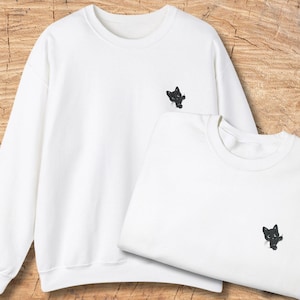 Curious Black Cat Embroidered Sweatshirt, Minimalist Cat Pocket Design, Cute Black Kitten Cozy Unisex Crewneck