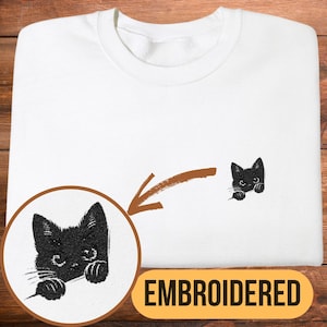 Shy Black Cat Embroidered Sweatshirt, Minimalist Kitten Pocket Design, Cozy Crewneck for Cat Lovers