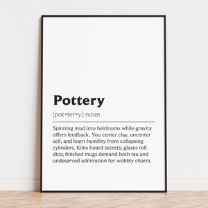 May include: A framed print with the word "Pottery" in bold black font. Below, a definition describes the art of pottery, including the process of shaping clay and the challenges involved. The print is in a black frame.