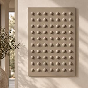May include: A rectangular wall art piece in a solid beige tone featuring a grid of raised, circular, dome-shaped protrusions arranged in eight rows and six columns, creating a uniform, textured, and three-dimensional geometric pattern.