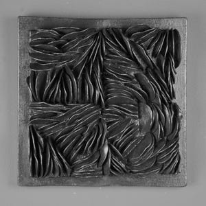 May include: Black and white abstract wall art with a textured, layered design. The art is framed in a black wood frame.