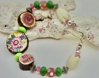 Floral mauve and pink boho beaded bracelet, Mothers day gift, handmade art jewelry, mauve and green colors, woodland botanical gift for her