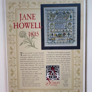 May include: A framed cross-stitch sampler reproduction by Jane Howell, dated 1835. The sampler features a floral border, alphabet, numerals, and a verse. The original sampler measures 13 x 16 inches.