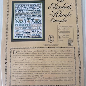 May include: The Elisabeth Rhode Sampler kit includes charted directions, 27-count and 35-count linen, floss, and a needle. The reproduction measures 5.5" x 7" on 35-count linen and 7" x 9" on 27-count linen. The sampler is embroidered using Cross Stitch and Satin Stitch.