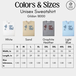 May include: Unisex sweatshirts in white, sand, graphite heather, and light blue, featuring a graphic of a fan and a dachshund. Sizes range from S to 5XL, with width measurements from 20 to 34 inches and lengths from 27 to 34 inches.
