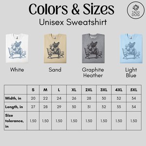 May include: Unisex sweatshirt in white, sand, graphite heather, and light blue. Each shirt features a dog illustration. Sizes range from S to 5XL, with widths from 20 to 34 inches and lengths from 27 to 34 inches.