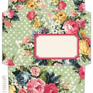 May include: A flat, unfolded envelope template featuring a light green background with white polka dots and a floral pattern of pink, yellow, and blue roses. A blank, rectangular label with a pink border is centered. Text reads 5 x 7 ENVELOPE.