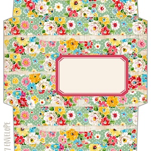 May include: A flat, unfolded envelope template featuring a repeating floral pattern with red, yellow, pink, and white flowers on a light green background with white polka dots and beige ledger lines. A blank rectangular label with a red border is centered.