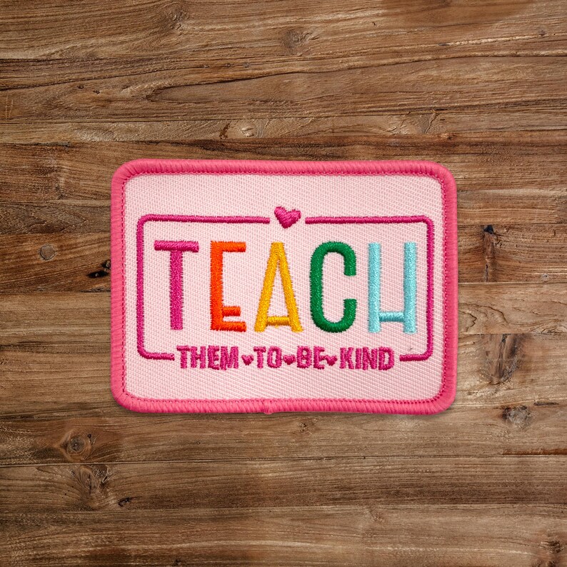 a picture of a patch that says teach them to be kind
