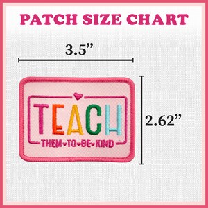 a pink patch with the words teach on it