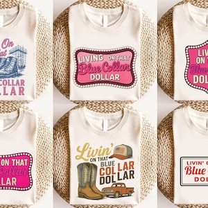 May include: A collection of six white t-shirts with various graphic designs. The designs feature text and illustrations related to the theme "Blue Collar Dollar". The shirts are displayed on a woven, circular surface.