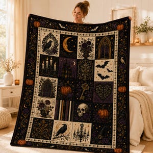 May include: A rectangular throw blanket featuring a dark, gothic-inspired patchwork design. The pattern includes illustrations of pumpkins, ravens, a skull, bats, a crescent moon, a candelabra, a key, and floral motifs in black, gold, and purple.