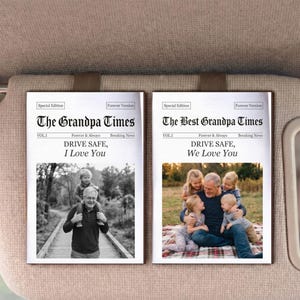 May include: Two framed newspaper-style prints titled "The Grandpa Times" and "The Best Grandpa Times." The first features a black and white photo of a grandfather with a child on his shoulders. The second shows a grandfather with grandchildren. Text includes "Drive Safe, I Love You" and "Drive Safe, We Love You."