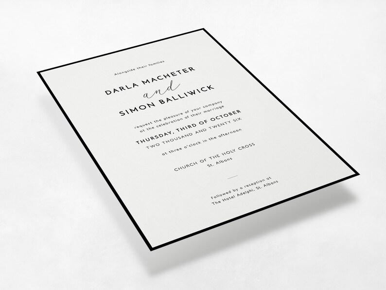 Perspective view of the Modern Border minimalist wedding invitation in black and white