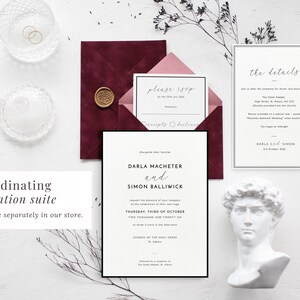 Co-ordinating Black border wedding invitation suite available to purchase in our store. Image shows the invitation, details card and RSVP with a burgundy envelope and classic styling props.