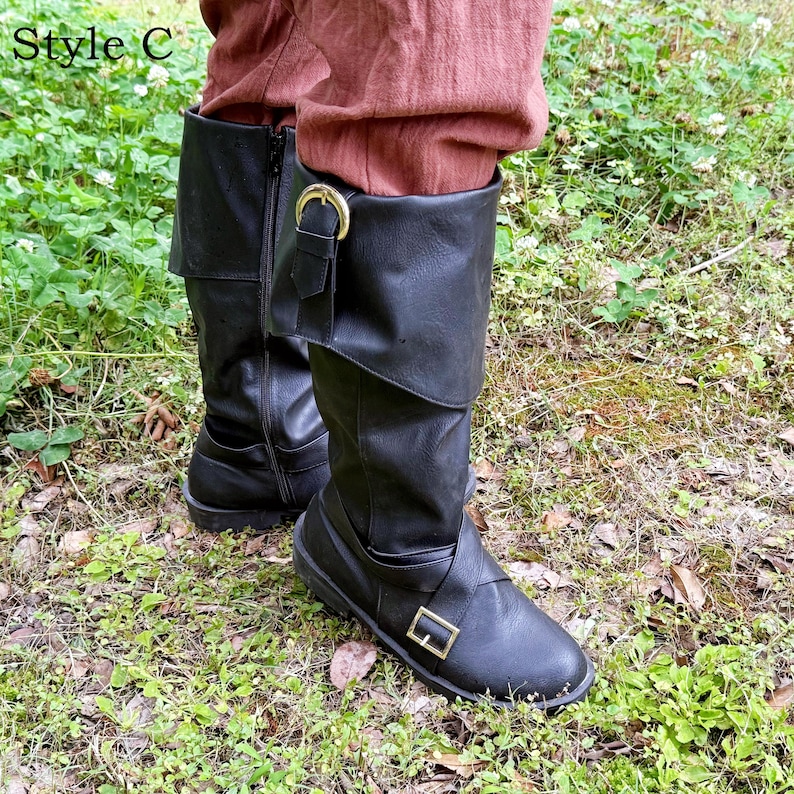 May include: Black leather boots with a fold-over cuff and buckle details. The boots have a side zip and are worn with reddish-brown trousers. The text "Style C" is in the upper left corner.