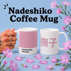 May include: Two white coffee mugs with the text "Nadeshiko Coffee Mug". One mug has a pink color block with the text "Nadeshiko #DC9FB4". The other mug has pink Japanese characters. Pink flowers are scattered around the mugs.