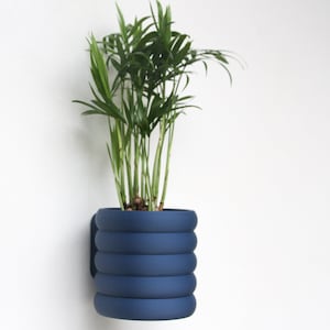 Wall-mounted flower pot with attractive 3D printed design