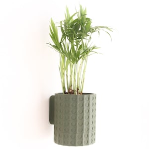 Wall-mounted flower pot with attractive 3D printed design