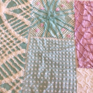 May include: A patchwork quilt with different textures and patterns in shades of pink, white, and light blue. The quilt is made of cotton fabric and has a soft, fluffy texture.