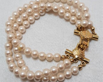 Vintage Richelieu Bracelet with 3 Strands of Cream Colored Faux Pearls. It Measures About 8 Inches Long and the Pearls Are About 6mm. (D2)