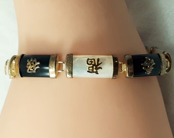 Vintage 7 Link Asian Bracelet with Black and White Links Topped with Lucky Chinese Characters Including Good Fortune and Longevity. (D39)